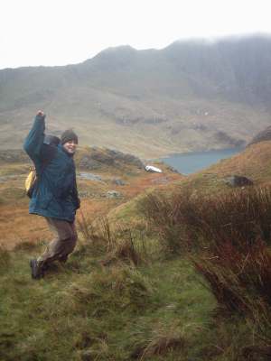 Kate doing something bizzare with Llyn Llydaw behind